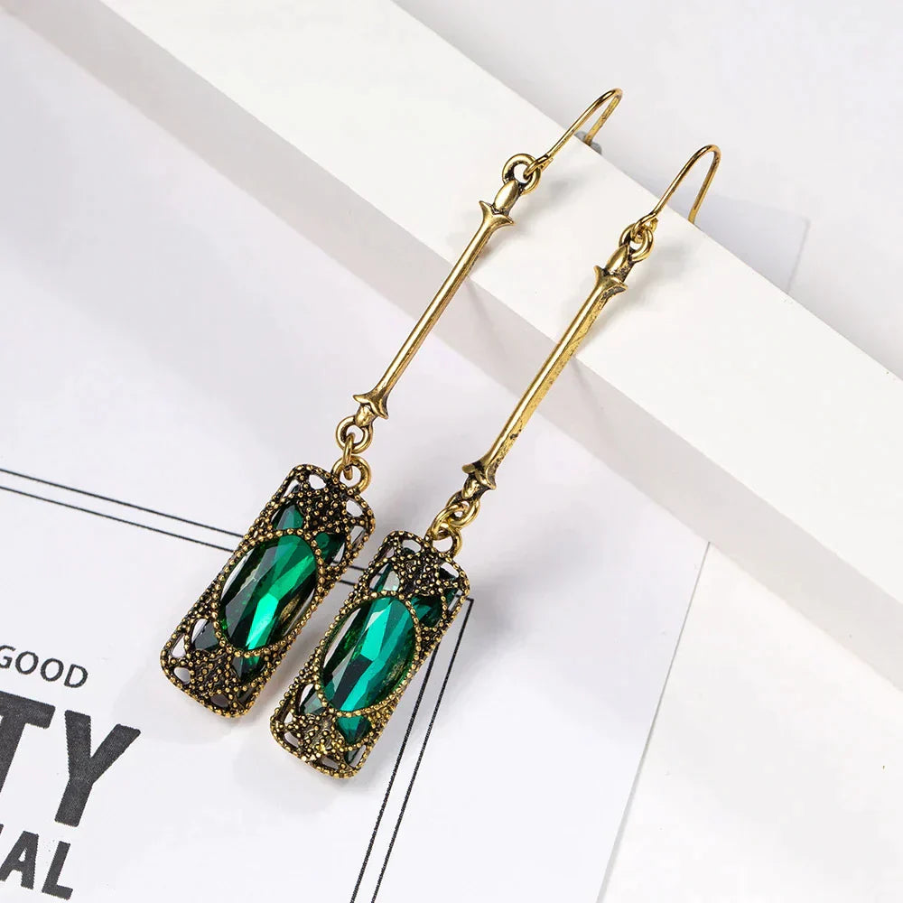 Chic Gold Earrings Adorned with a Stunning Green Lantern Pendant