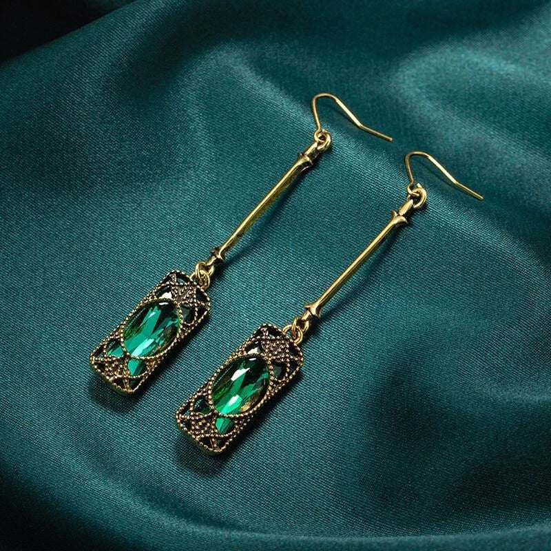 Chic Gold Earrings Adorned with a Stunning Green Lantern Pendant