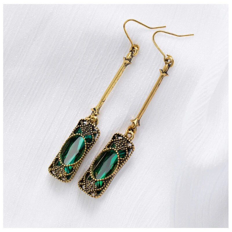 Chic Gold Earrings Adorned with a Stunning Green Lantern Pendant