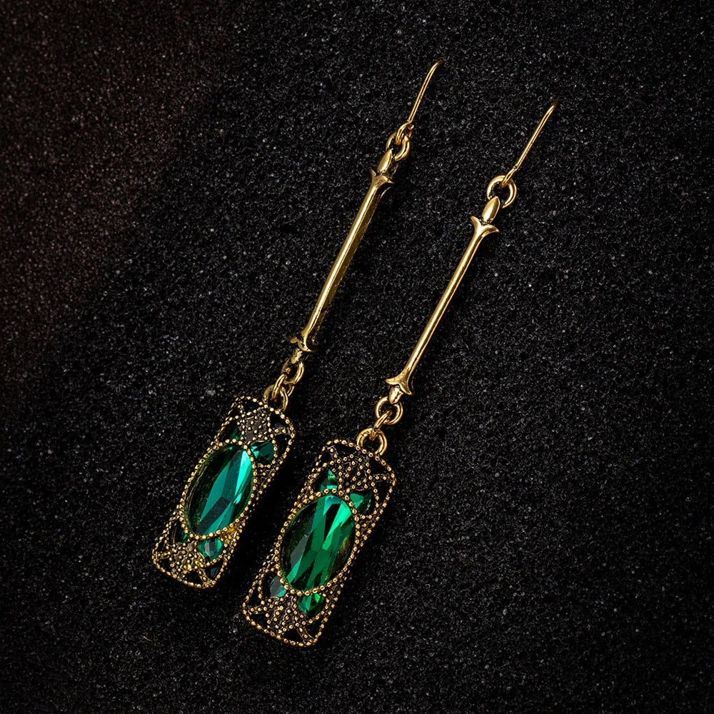Chic Gold Earrings Adorned with a Stunning Green Lantern Pendant