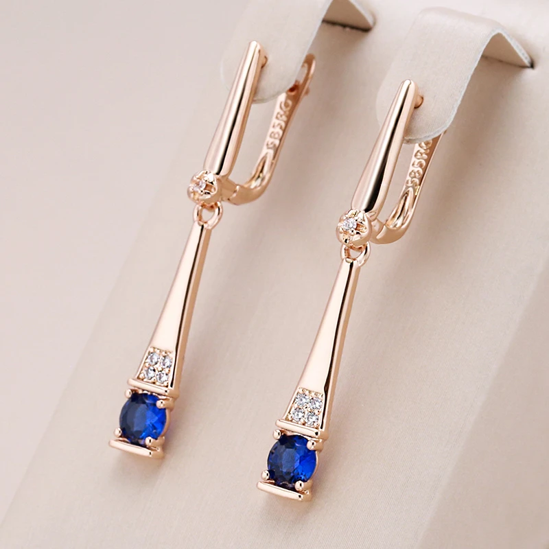 Stunning Gold Earrings Adorned with Dazzling Blue Crystal Pendants