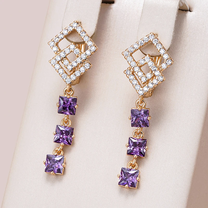 Radiant Golden Stud Earrings Adorned with Dazzling Purple Crystals