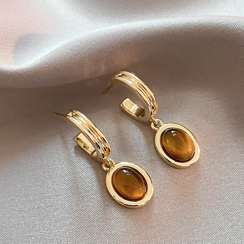 Stunning Golden Earrings Adorned with Dazzling Orange Crystals