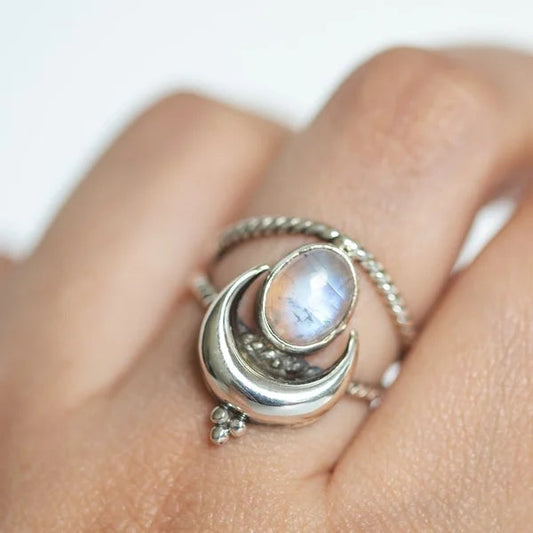 Captivating Oval Rainbow Moonstone Ring with Moon Phases Design