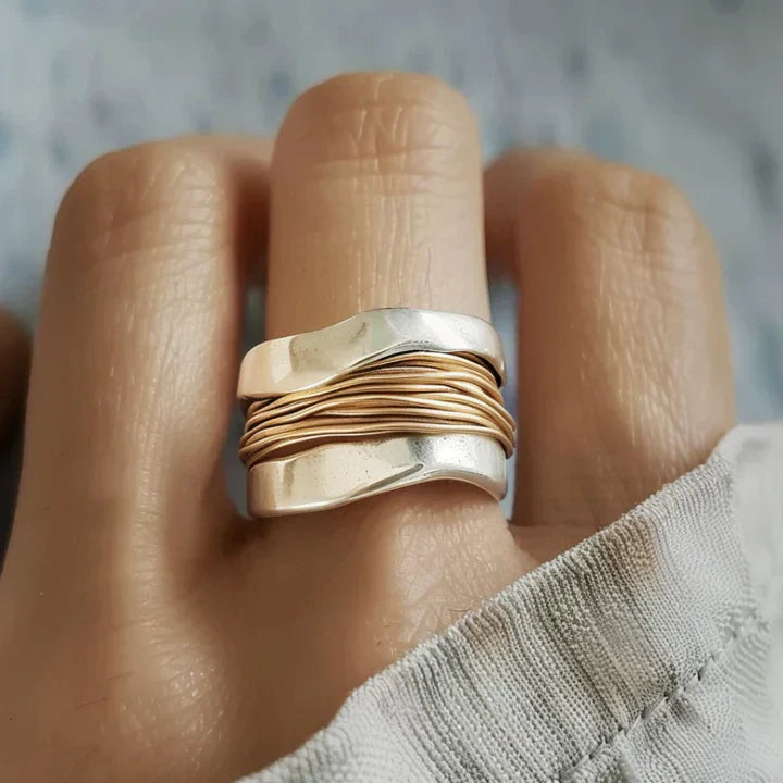 Elegant silver ring with delicate golden accents