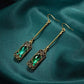 Chic Gold Earrings Adorned with a Stunning Green Lantern Pendant