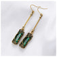 Chic Gold Earrings Adorned with a Stunning Green Lantern Pendant