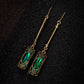 Chic Gold Earrings Adorned with a Stunning Green Lantern Pendant