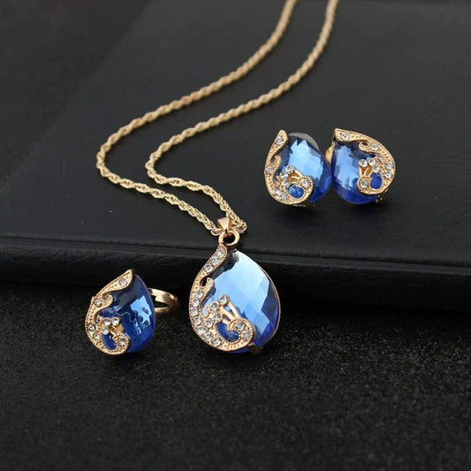 Elegant set of blue crystal necklace and earrings with golden accents