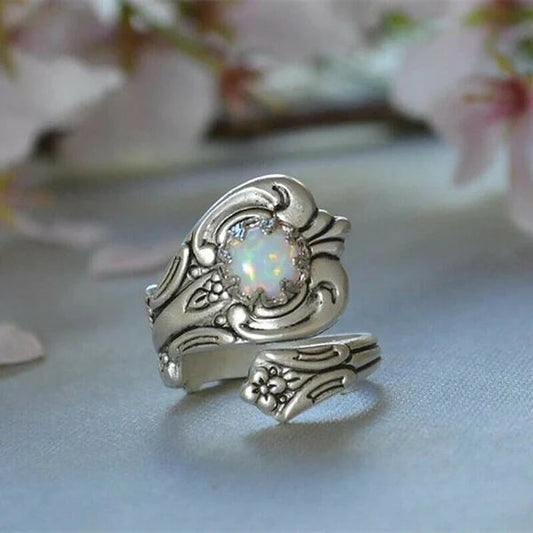 Elegant adjustable ring with a radiant white opal spoon