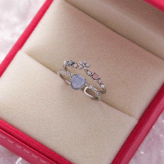 Elegant adjustable silver ring with radiant blue stone and sparkling zirconia