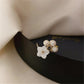 Elegant gold ring with adjustable pearl and flower motifs