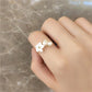 Elegant gold ring with adjustable pearl and flower motifs