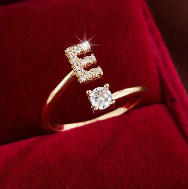 Elegant diamond letter ring made of gold and silver