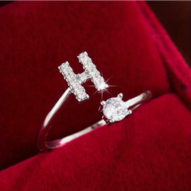 Elegant diamond letter ring made of gold and silver