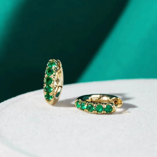 Chic Gold Nut Earrings Adorned with Dazzling Green Zirconia