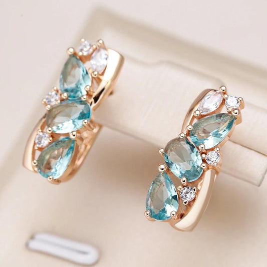 Stunning Gold Earrings Adorned with Dazzling Blue Zirconia Gemstones