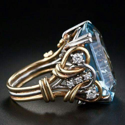 Vintage-inspired gold ring with radiant blue zircon