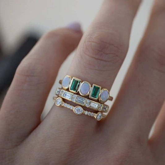 Elegant vintage ring with shimmering white and green opal