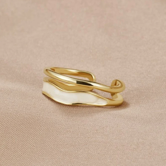 Elegant gold ring with stylish white enamel design