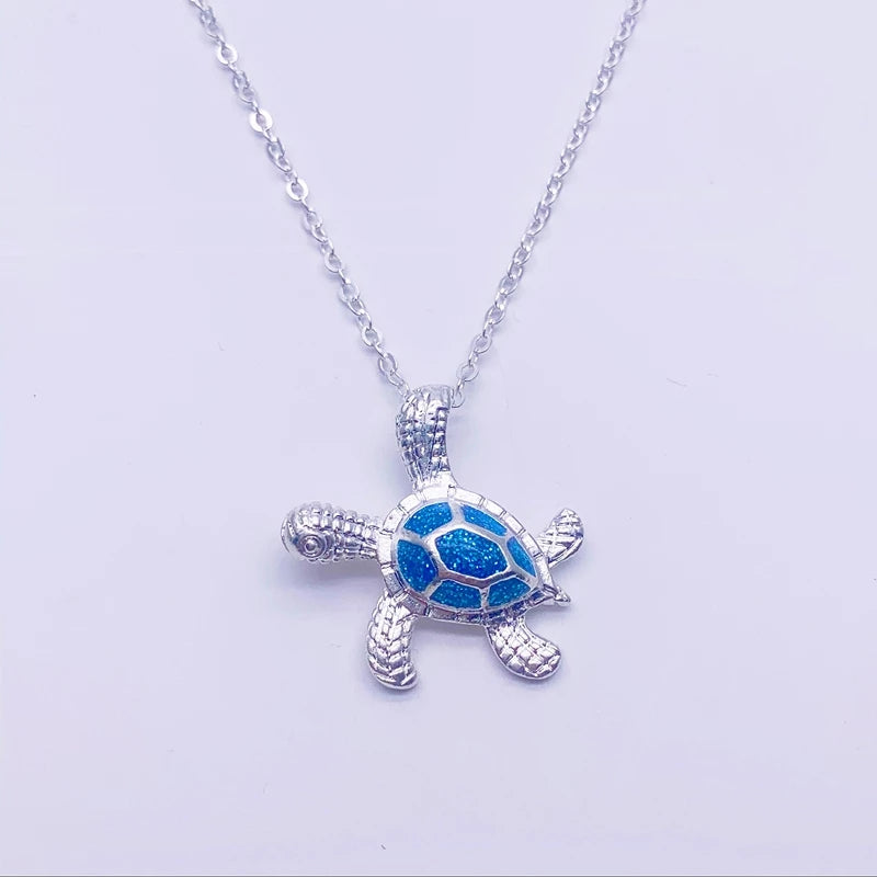 Necklace with sea turtle motif and sparkling blue opal