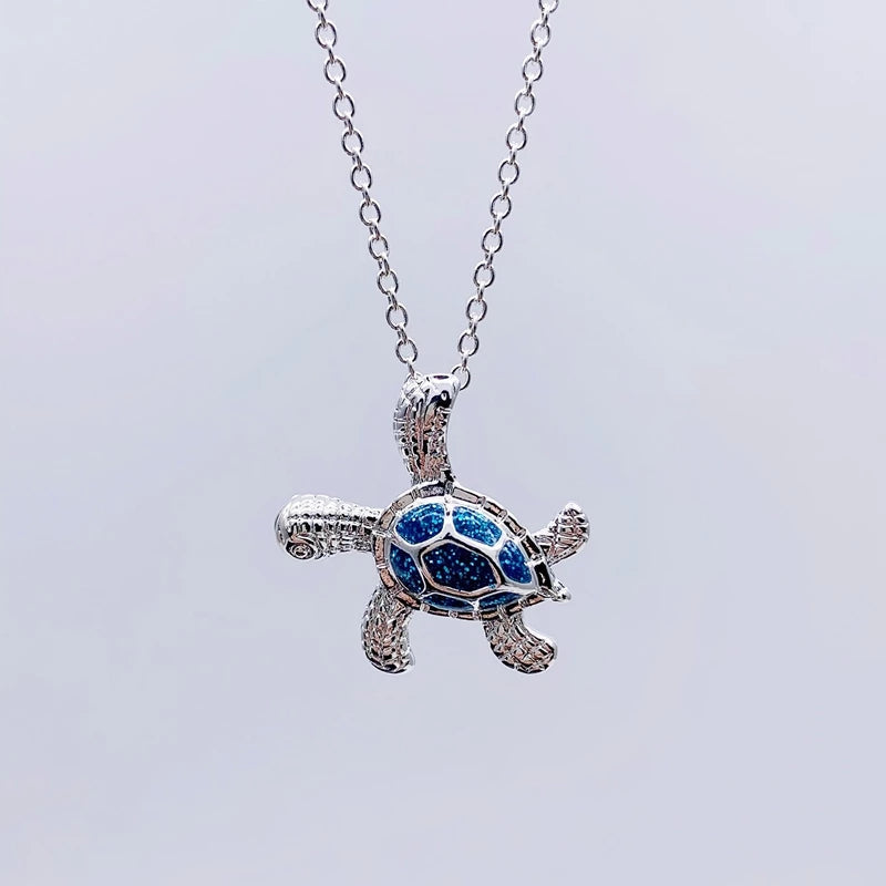 Necklace with sea turtle motif and sparkling blue opal