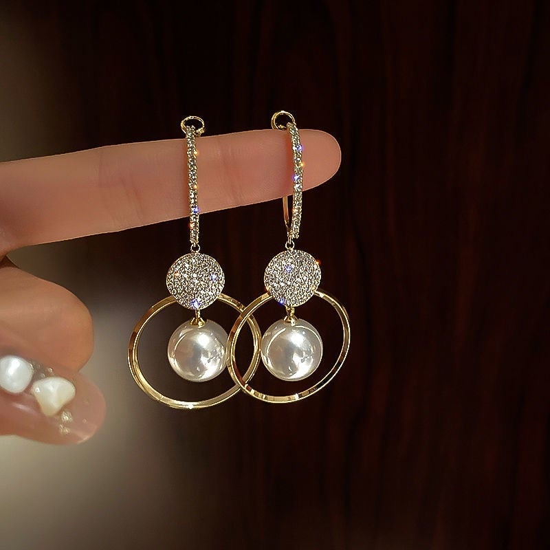 Elegant earrings with fine cultured pearls and sparkling zirconias