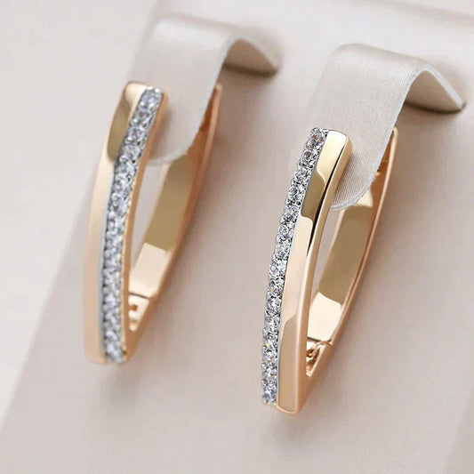Stunning gold-plated earrings adorned with shimmering diamond accents