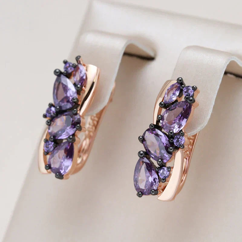 Elegant Gold Earrings Adorned with Exquisite Purple Crystals