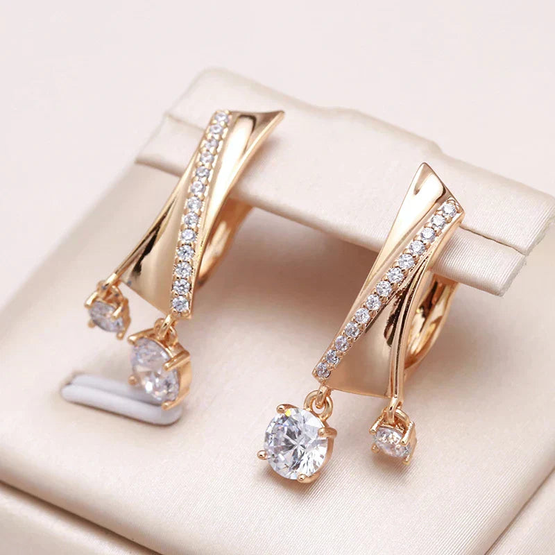 Elegant Gold Drop Earrings Adorned with Dazzling Zirconia Stones