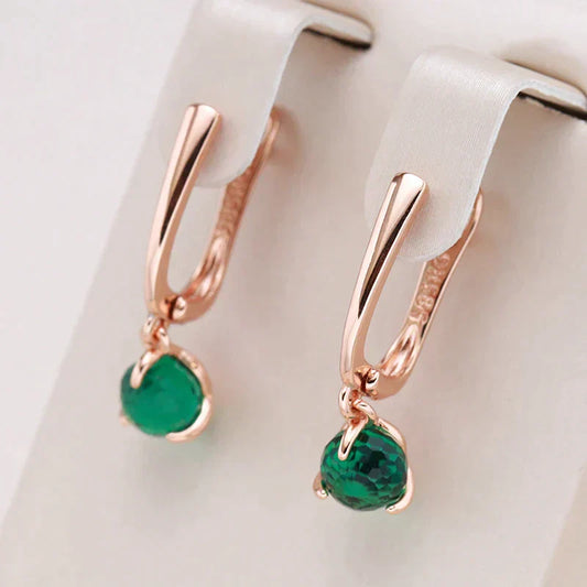 Radiant Gold Earrings Adorned with Dazzling Green Crystals