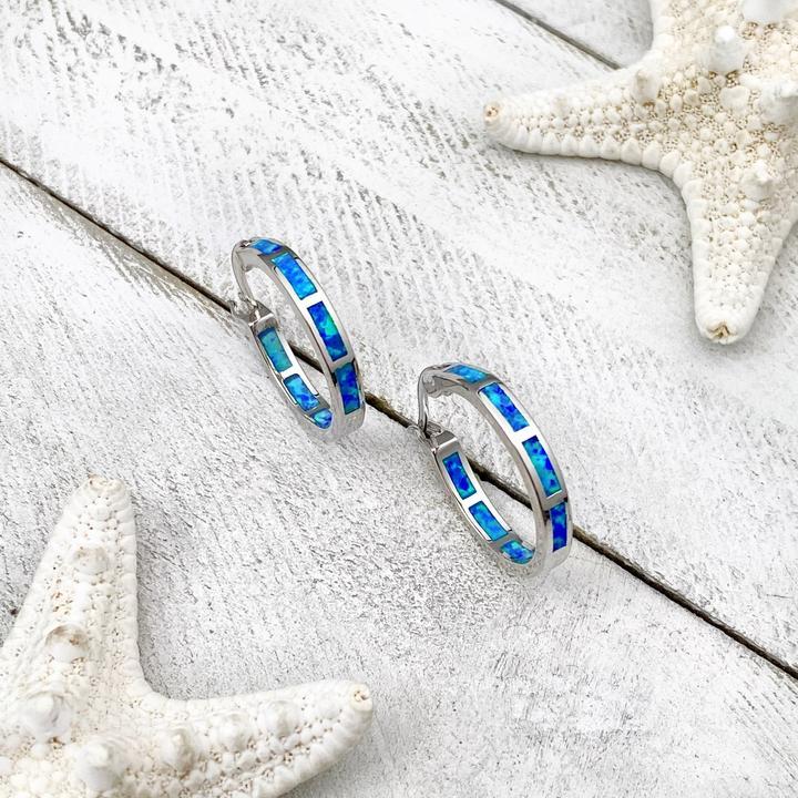 Elegant silver rings with shimmering opal, inspired by the ocean