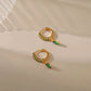 Stunning Gold Earrings Adorned with Dazzling Zirconia and Radiant Emeralds