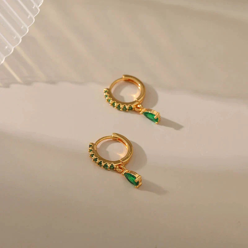 Stunning Gold Earrings Adorned with Dazzling Zirconia and Radiant Emeralds