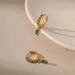 Stunning Gold Earrings Adorned with Dazzling Zirconia and Radiant Emeralds