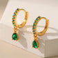 Stunning Gold Earrings Adorned with Dazzling Zirconia and Radiant Emeralds