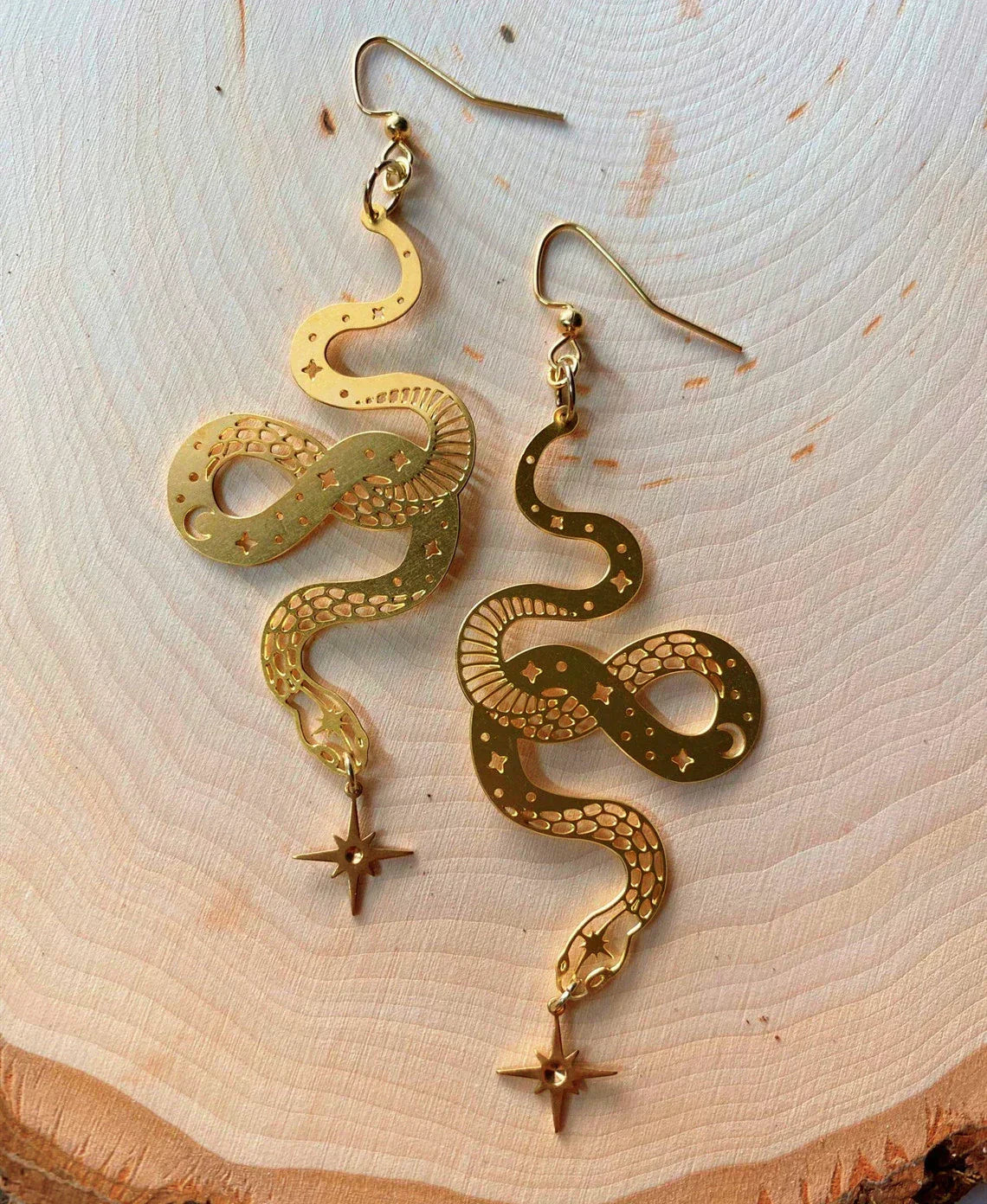Stunning Gold Earrings Featuring a Dazzling Star Snake Pendant