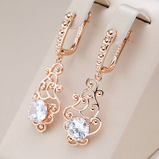 Dazzling Golden Earrings Adorned with Radiant Crystals