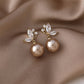 Stunning Earrings Featuring Luxurious Exotic Pearls and Dazzling Gold Crystals