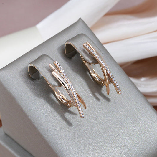 Elegant Gold Cross Earrings Adorned with Dazzling Diamonds