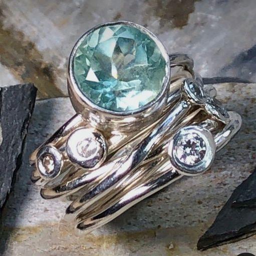 Elegant multi-layered silver-plated ring with radiant turquoise vintage crystal