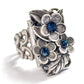 Blooming sapphire ring with floral accents