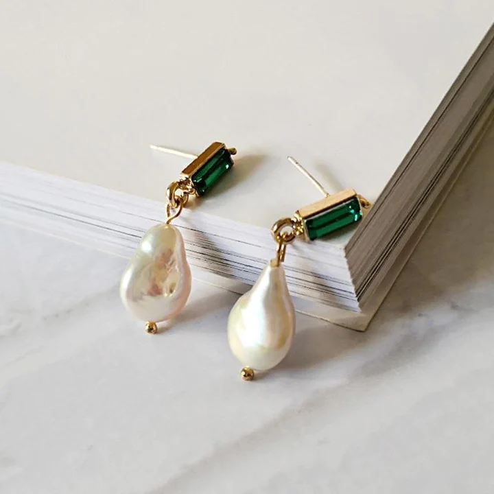 Elegant gold pearl earrings with radiant emeralds