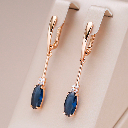 Exquisite Gold Earrings Adorned with Dazzling Blue Crystals