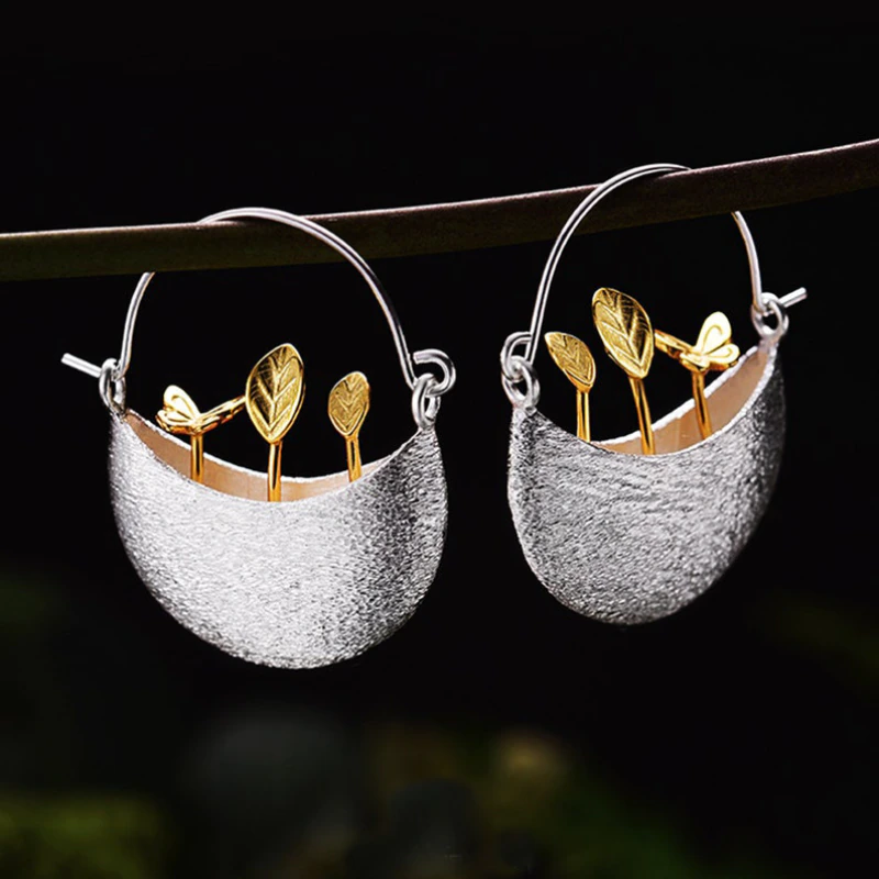 Stunning Silver Earrings Featuring a Luxurious Gilded Flower Basket Design