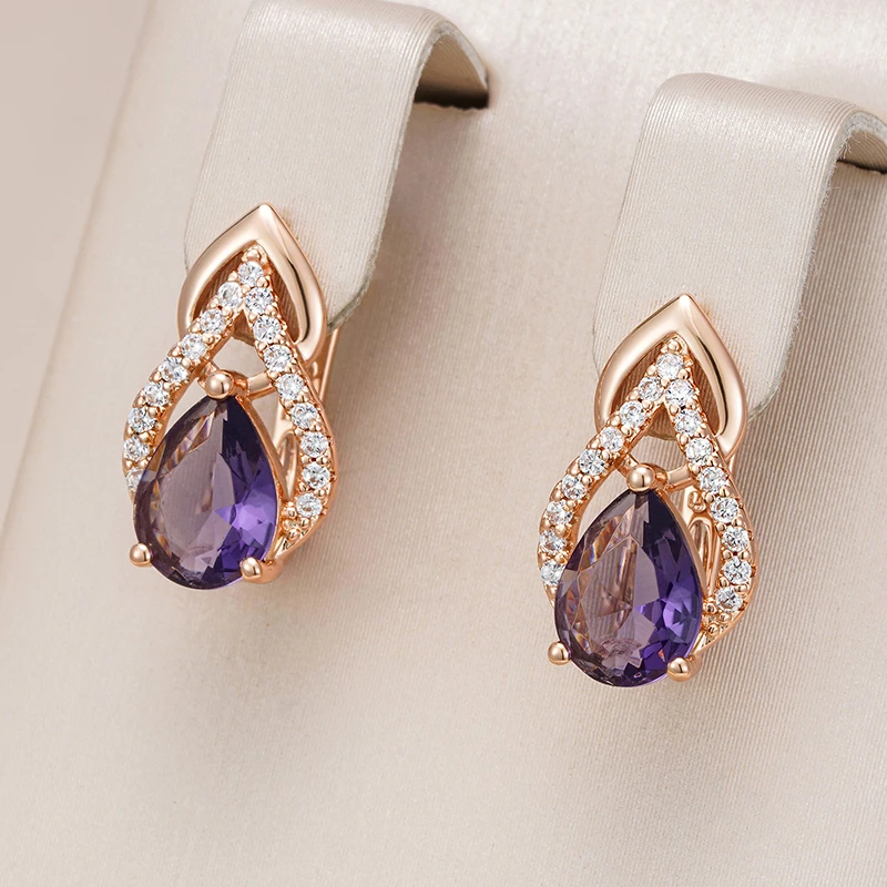 Elegant Gold Earrings Adorned with Stunning Purple Crystal Drops