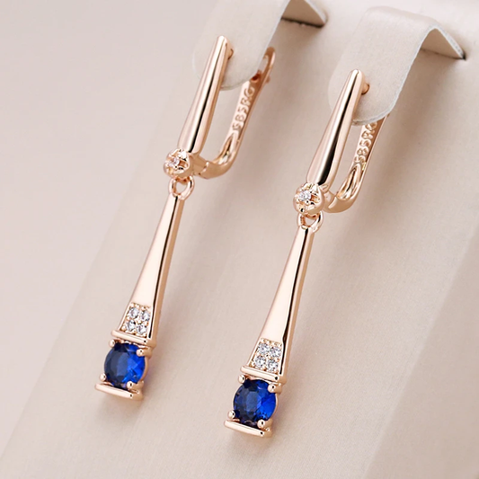 Stunning Gold Earrings Adorned with Dazzling Blue Crystal Pendants