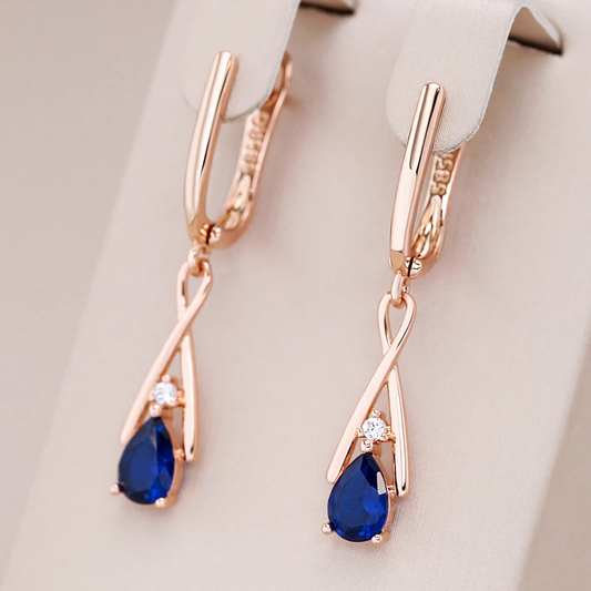 Stunning Gold Earrings Featuring Dazzling Blue Pendants