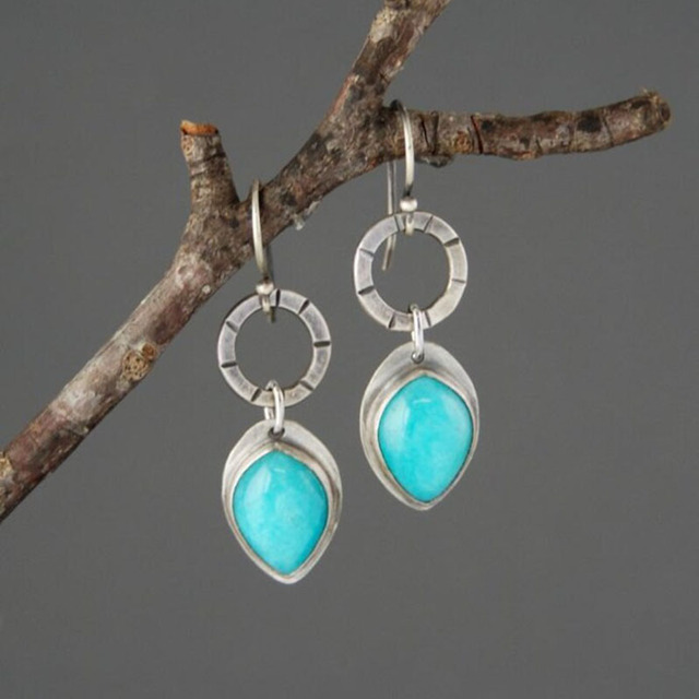 Stunning Vintage Earrings Featuring a Dazzling Blue Gem in Elegant Silver