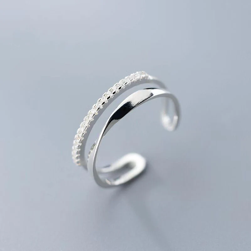 Elegant adjustable silver ring with sparkling zirconia stones